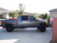 Anyone have pics of 285's and leveling kit.-new-tires-001.jpg